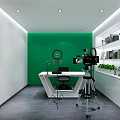 Modern Meeting Room Interior With Green Backdrop White Table Camera And Shelved Plants Books