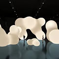 Large White Abstract Sculptures With People Standing On Reflective Dark Floor