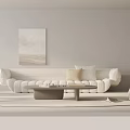 Modern Minimalist Sofa And Coffee Table Set With White Upholstery Wall Art And Stacked Books
