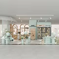 Elegant Light Luxury Boutique Store Interior With Light Green Display Shelves And Decorative Plants