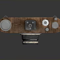 Vintage Electronic Camera Device With Retro Leather Cover And Classic Metal Body
