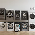 Different Styles And Colors Of Washing Machines Neatly Arranged With Clothes In Front