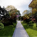 Residential Landscape With Green Lawn Trees Pedestrian Walkway Benches And Kids Play Area