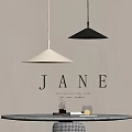 Minimalist White And Black Conical Pendant Lights In Modern Interior Above Table