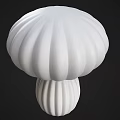White and Beige Mushroom Shaped Table Lamps with Striped Design on Black Background