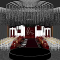 Banquet Hall With Circular Stage Red Carpet White Chairs Crystal Chandeliers And Backdrop Decor