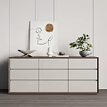 Modern Minimalist White Entryway Console Cabinet With Decorative Painting Green Plant Books And Vase