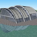 Modern Arched Glass Building With Metal Frame Under Blue Sky And Hexagonal Pavement