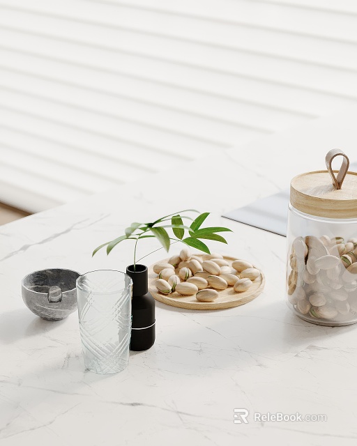 Stylish Home Decor Items With Pistachios Glass Jar Green Plant On White Marble Countertop 3d model 