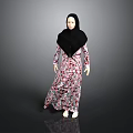Woman in Floral Dress and Black Hijab Standing Against Gray Background