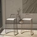 Modern Bar Stools With Metal Frame And White Cushioned Seat In Minimalist Interior