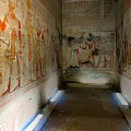 Ancient Egyptian Tomb Wall With Colorful Murals And Hieroglyphic Carvings