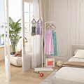 Elegant Bedroom Interior With Clothing Rack Colorful Dresses Green Plant And Decor Items