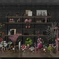 Bonsai Potted Plants With Various Flowers Displayed On Shelves And Pink Flamingo Decor