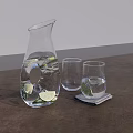 Transparent Glass Pitcher With Lime Slices And Water Alongside Glasses On Dark Table Surface