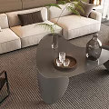 Modern Gray Irregular Coffee Table With Tray Glass Cups Vase And Green Plant In Living Room