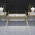 Golden Display Shelves Showcasing Necklaces And Watches On Black Background With Marble Floor