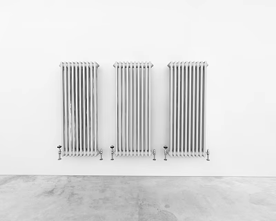 Three Silver Radiators Mounted on White Wall with Gray Concrete Floor 3d model