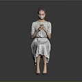 Woman In Plaid Dress And Heels Using Mobile Phone Against Grey Background