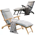 Comfortable Modern Lounge Chair With Black Metal Wooden Frame Gray Blue Cushion And Gray Blanket