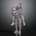 Two Happy People Enjoying Piggyback Ride Together In Casual Outfits
