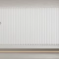 White Vertical Blinds Enhance Modern Interior with Potted Plant on Shelf