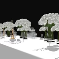 Elegant Formal Dining Table Set with White Flower Bouquets Tableware Wine Glasses and Candle Holders