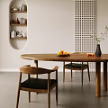 Wooden Oval Dining Table with Black Leather Chairs Fruit Plate and Green Plant Vase