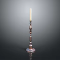 Metal Candle Holder With Decorative Column Base And Lit White Candle On Dark Background