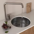 Stainless Steel Kitchen Sink With Running Water Faucet Wooden Cutting Board And Fresh Cherries