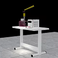 Purple Clamping Device And White Electronic Equipment With Red Wires On White Table Top