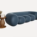 Modern Blue Rounded Multi Seater Sofa With Wooden Side Table And Decorations 3d model