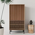 Wooden Entryway Side Cabinet With Vertical Slats Black Legs Near Large Green Plant Decorative Vase