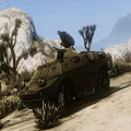 Military Tank In Desert Terrain With Rocky Landscape And Mountain Background