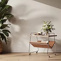 Side Table With Wooden Top Metal Frame Wheels Green Plant Vase Cups Cookies And Book