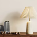 Modern Table Lamp With White Base Gold Stand Pleated Lampshade On Wooden Cabinet Glass Vases