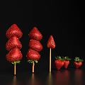 Fresh Juicy Red Strawberries Skewers And Whole Strawberries Against Black Background