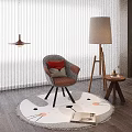 Gray Accent Chair With Red Cushion On Cat Face Pattern Round Rug And Floor Lamp
