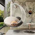 White Mesh Hanging Chair With Cushions And Blanket Indoor Near Window Marble Wall Green Plants