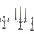Brass Candle Holders With Three Two And Single Arms Holding White Candles