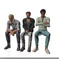 Group of Three Men Sitting Together in Different Casual Outfits and Poses