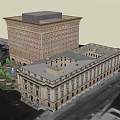 Tall Classical Office Building With Multiple Windows Adjacent Low Rise And Trees