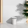 Modern White Toilet With Sleek Black Edge In Bright Bathroom Interior With Palm Tree