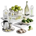 Fresh Green Apples Limes and Citrus Slices with Refreshing Drinks on Marble Tray