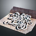 White And Gray Tangled Rope Piled On Textured Mat Beside Brick Wall