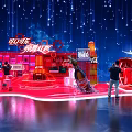 Coca Cola Exhibition Booth Red Themed Design With Large Bottle Models And Visitors