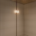 Modern Wall Sconces With Glass Shades On Textured Wall And Warm Lighting Glow