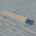 Public Bench with Wooden Seat and Metal Frame on Stone Pavement