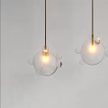 Modern Bubble Decor Glass Sphere Pendant Lights Hanging Against White Wall With Visible Bulbs