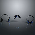 Three Stylish Electronic Headphones With Black And Blue Design On Reflective Surface